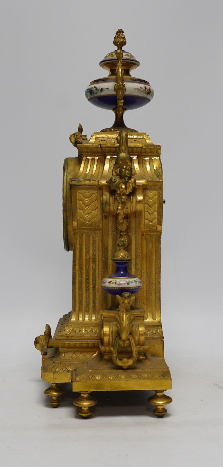 A late 19th century French ormolu mantel clock, MR and Co. Ernest Viroy, with key and pendulum, 39cm